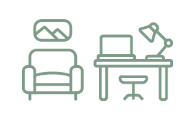 An icon showing an arm chair as well as a desk, stool, laptop and lamp.