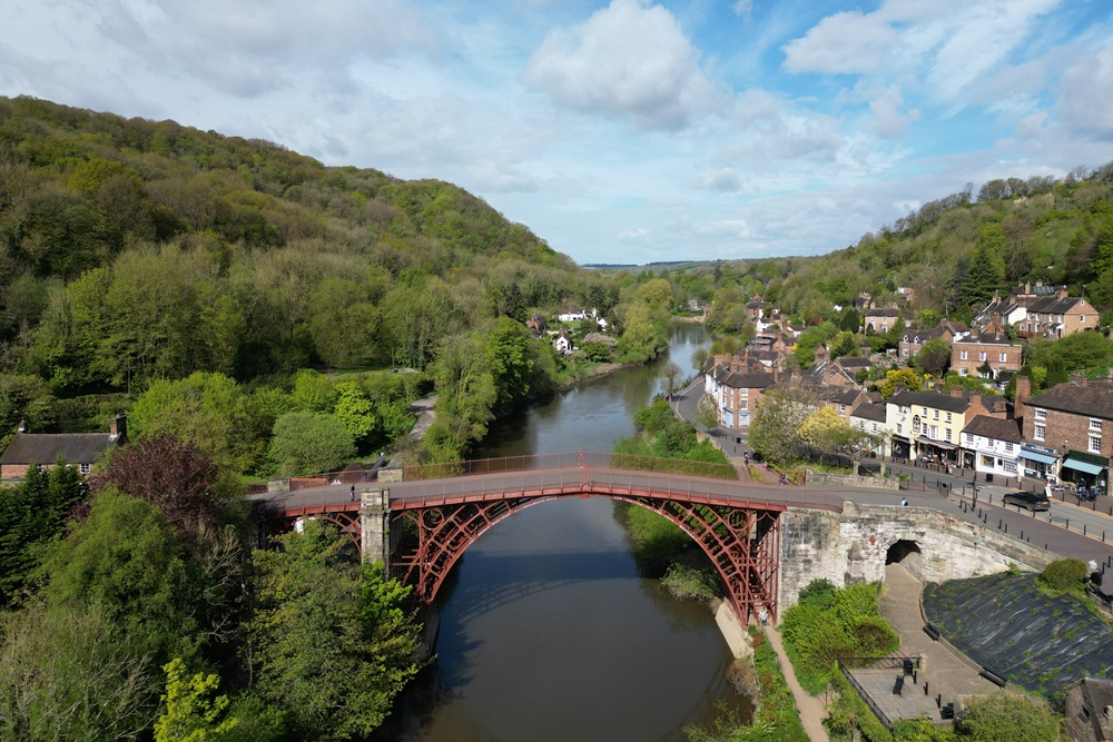 An aerial photograph showing the Ironbridge spanning the River Severn.